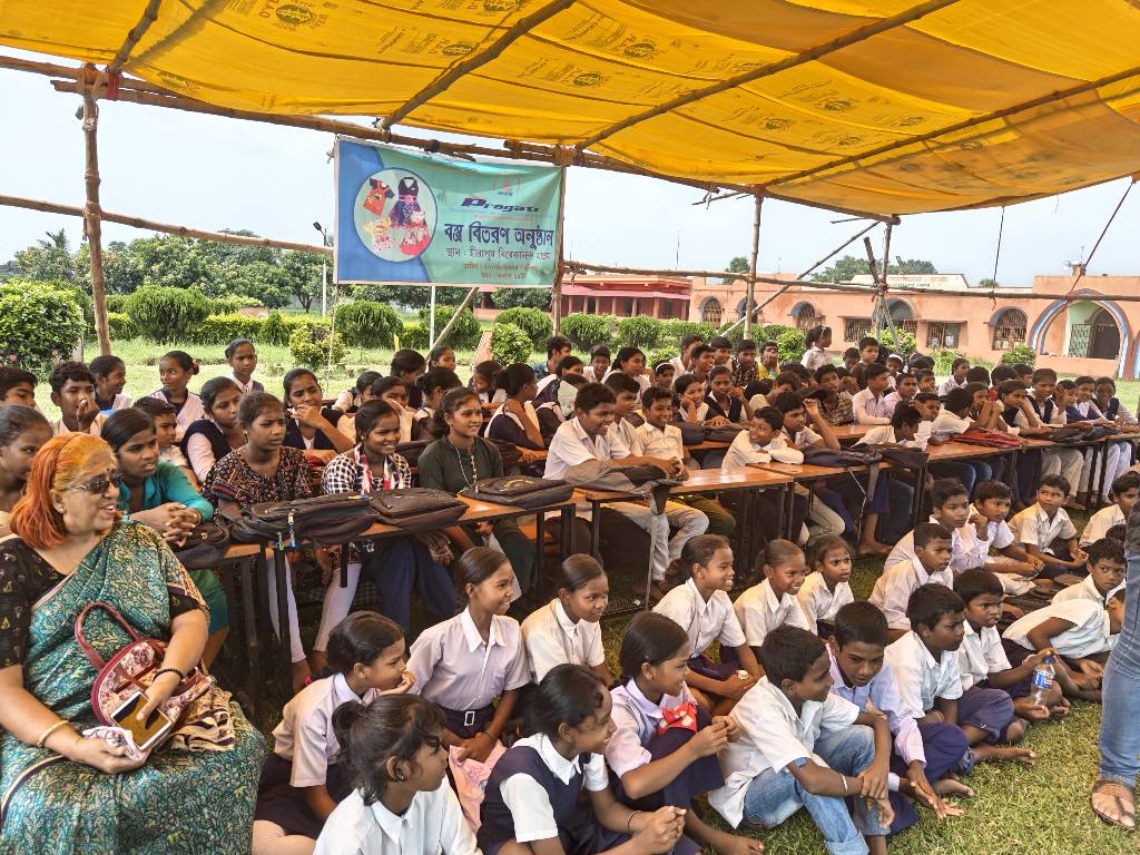 Children studying in a group, representing the educational outreach program.