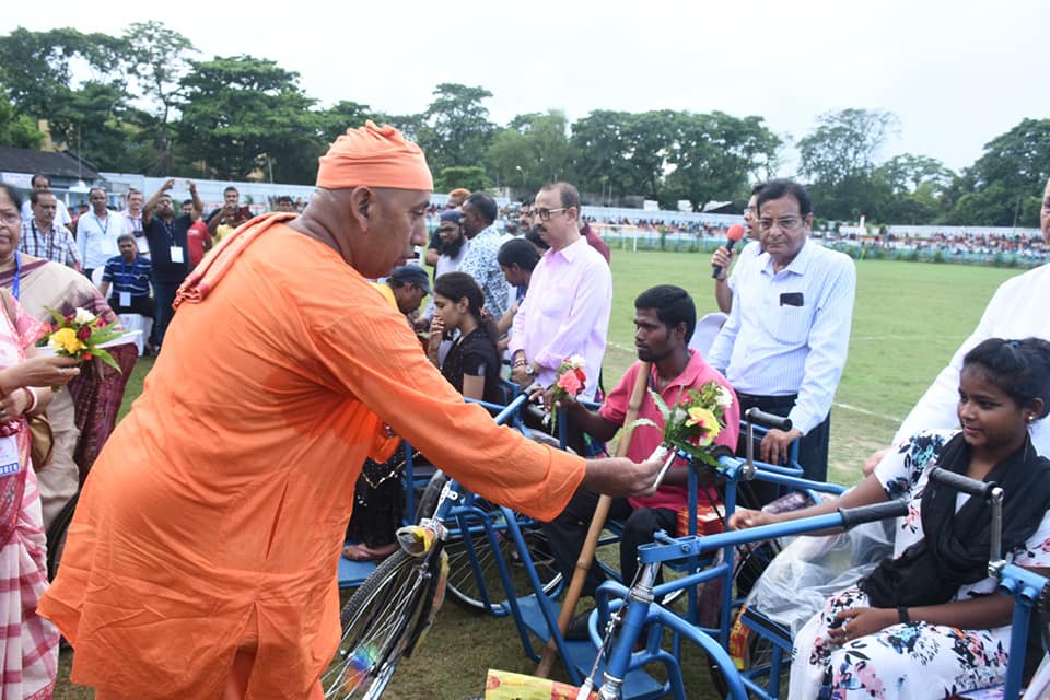 Hands holding a sapling, symbolizing growth, sustainability, and hope.