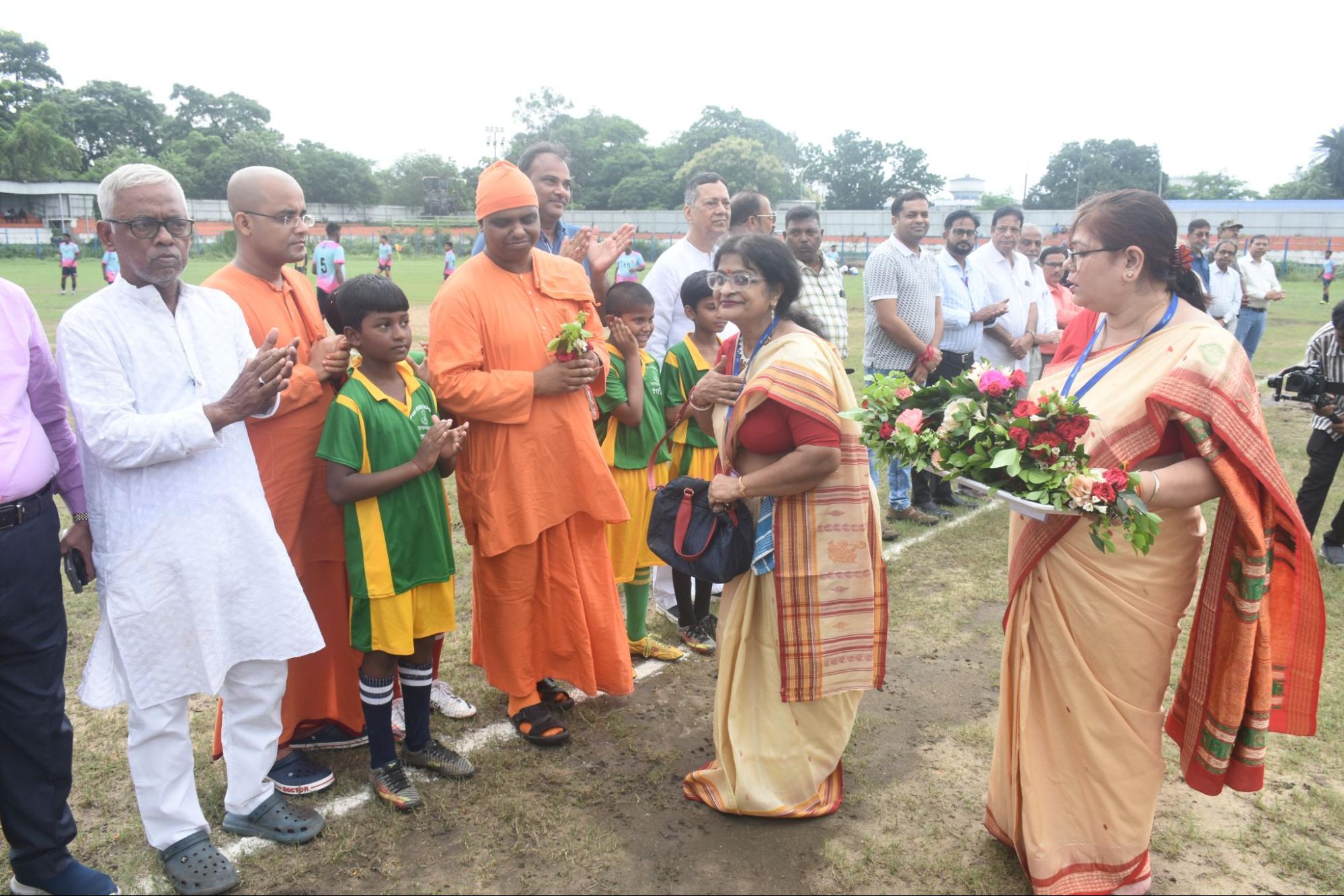 A group of people collaborating on a community project, representing the founding story of the organization.